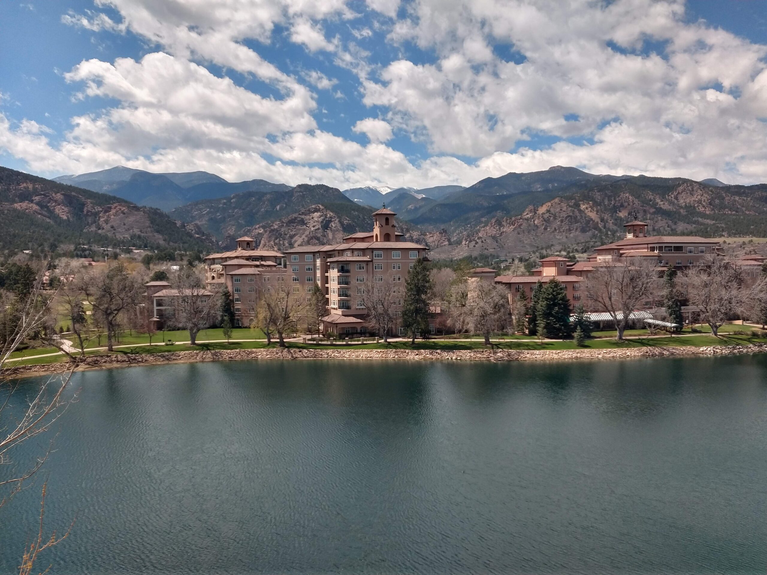 The Broadmoor hotel across its lake with Cheyenne Mountain behind it
