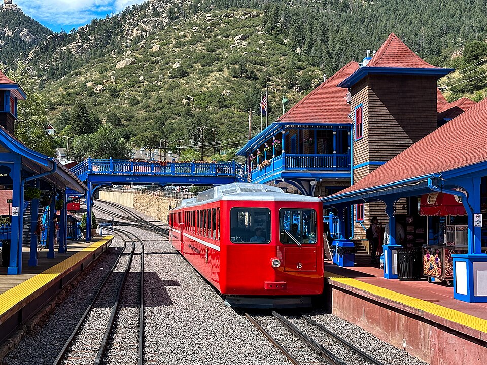 Red Manitou and Pikes Peak cog train beside the depot at Manitou Springs.
